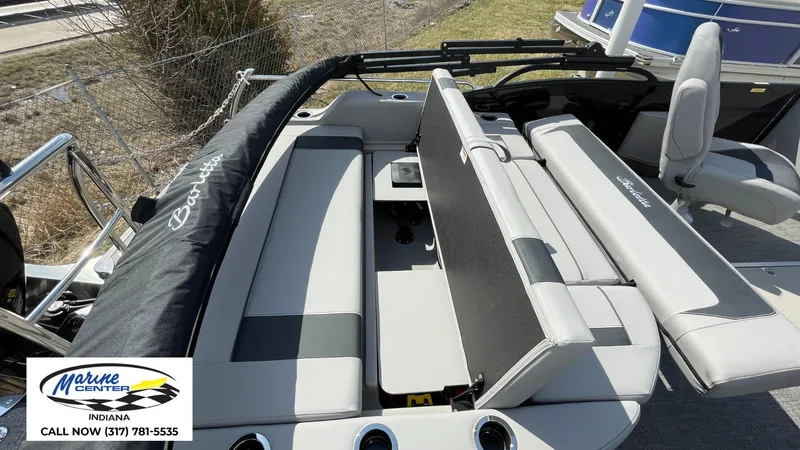 Slide: The Image of 2025 Barletta Aria A24UC boat interior with seating and storage, Marine Center contact info visible. - 17