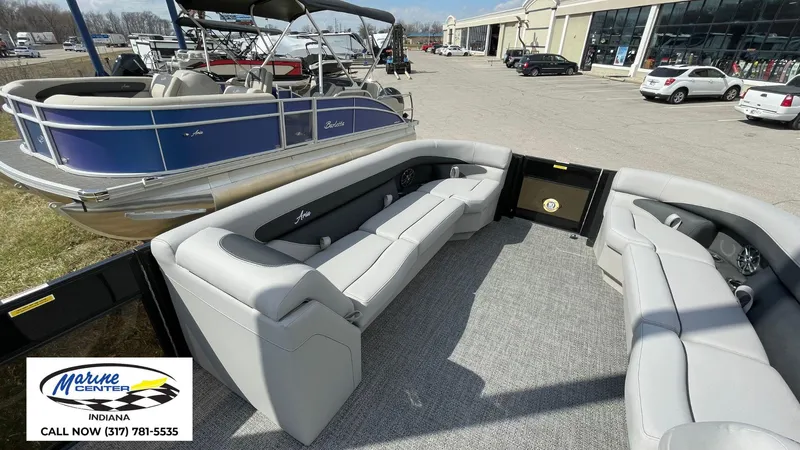 Slide: The Image of 2025 Barletta Aria A24UC pontoon boat with spacious seating at Marine Center Indiana. - 24