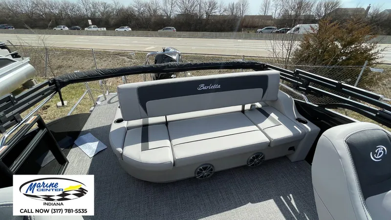Slide: The Image of 2025 Barletta Aria A24UC pontoon boat interior with seating, displayed at Marine Center Indiana. - 3