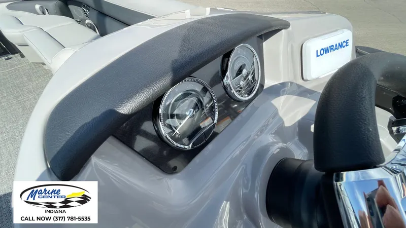 Slide: The Image of 2025 Barletta Aria A24UC dashboard with gauges and Lowrance system. - 6