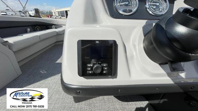 Slide: The Image of 2025 Barletta Aria A24UC boat dashboard with JBL audio controls, Marine Center logo visible. - 7
