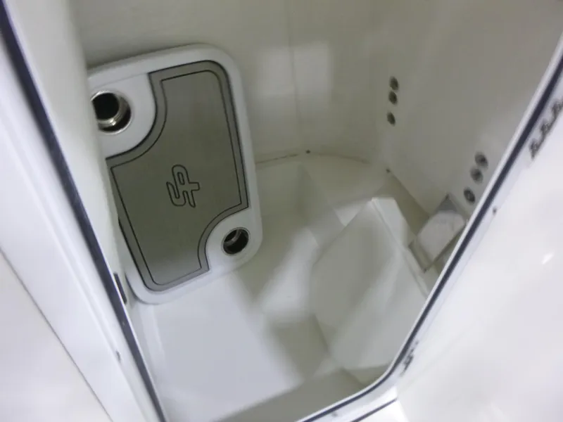 Slide: The Image of Interior view of 2025 Sea Pro 225 Sandbar boat compartment, featuring storage space and sleek design. - 17