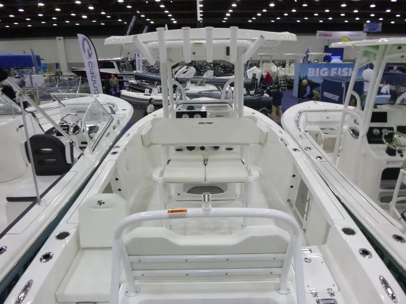 Slide: The Image of 2025 Sea Pro 225FLX Sandbar boat on trailer, blue hull, sunny day. - 4