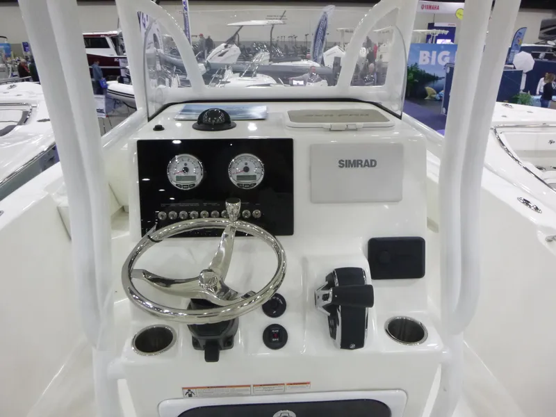 Slide: The Image of 2025 Sea Pro 225FLX Sandbar boat on trailer, blue hull, clear sky background. - 5