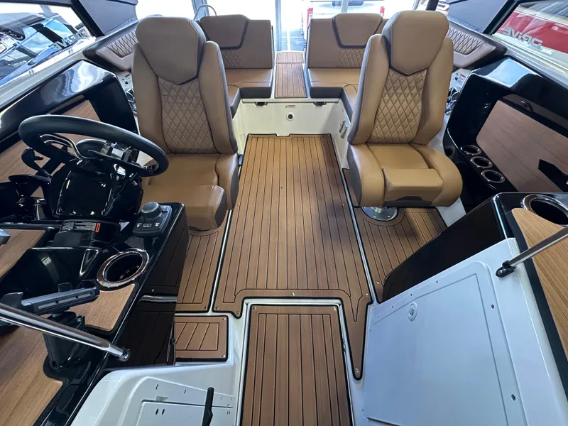 Slide: The Image of 2024 Yamaha 222SD jet boat interior with luxurious seating and sleek design. - 10