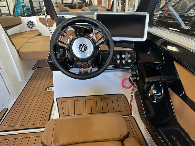 Slide: The Image of 2024 Yamaha 222SD jet boat cockpit with steering wheel and control panel. - 7