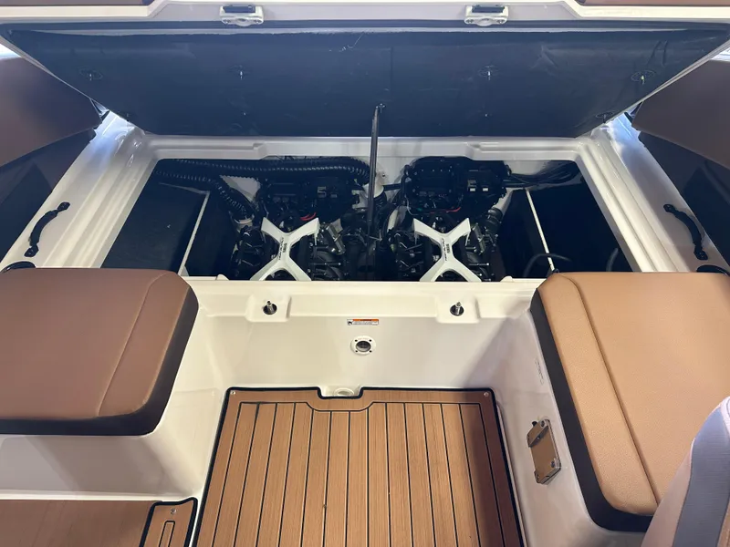 Slide: The Image of 2024 Yamaha 222SD jet boat engine compartment with dual engines and seating. - 8