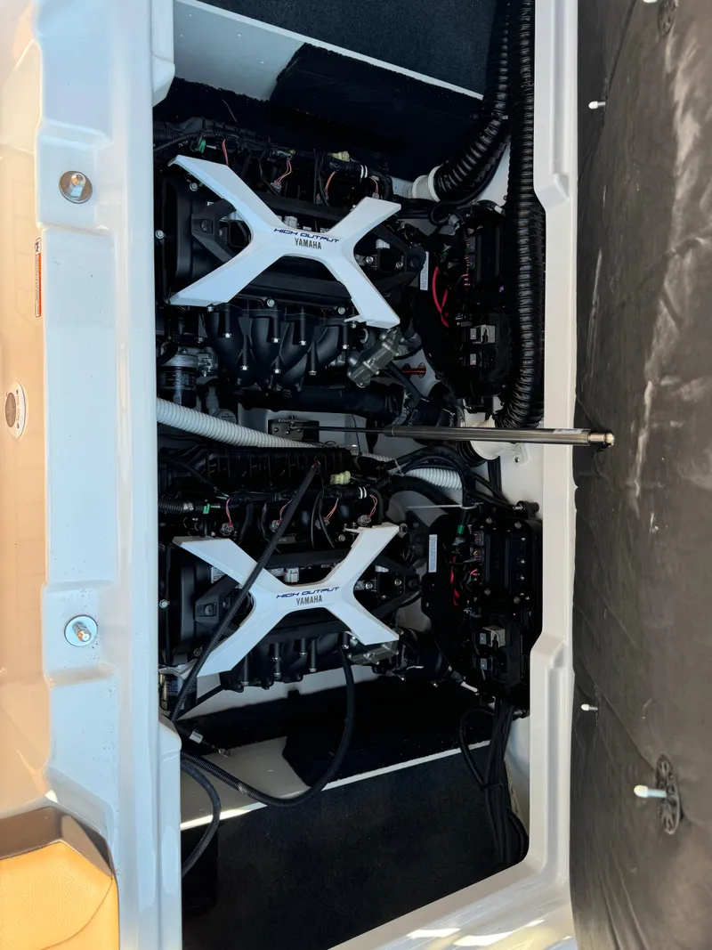 Slide: The Image of 2024 Yamaha 222SD jet boat engine compartment with dual engines visible. - 10