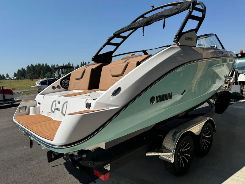 Slide: The Image of 2024 Yamaha 222SD jet boat on trailer, sleek design, outdoor setting. - 5