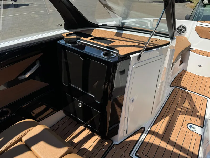 Slide: The Image of 2024 Yamaha 222SD jet boat interior with sleek design and wood accents. - 9