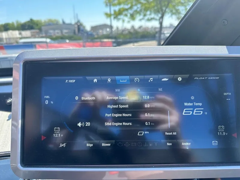 Slide: The Image of 2024 Yamaha 222XD dashboard display showing speed, water temperature, and Bluetooth connectivity. - 13