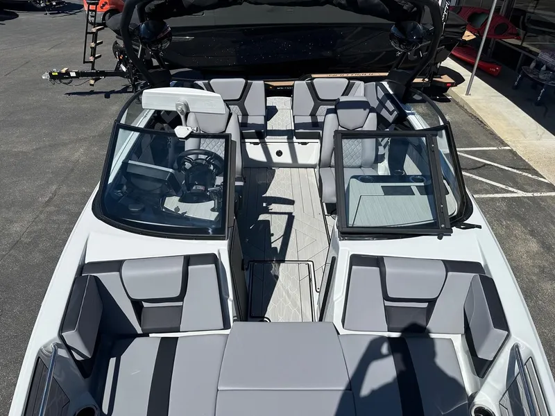 Slide: The Image of 2024 Yamaha 222XD jet boat interior with sleek seating and modern design. - 17