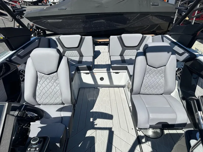 Slide: The Image of 2024 Yamaha 222XD jet boat interior with gray seating and modern design. - 18