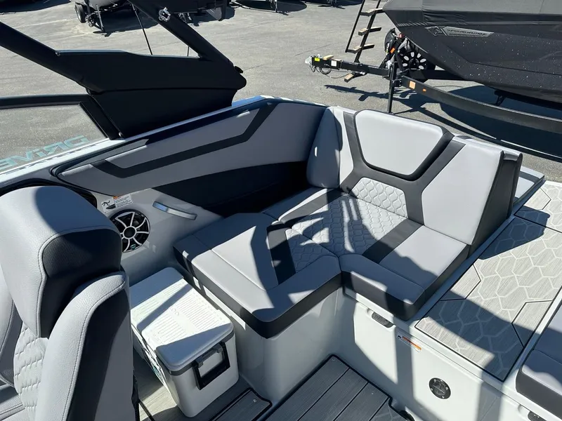 Slide: The Image of 2024 Yamaha 222XD jet boat interior with gray seating and modern design. - 19