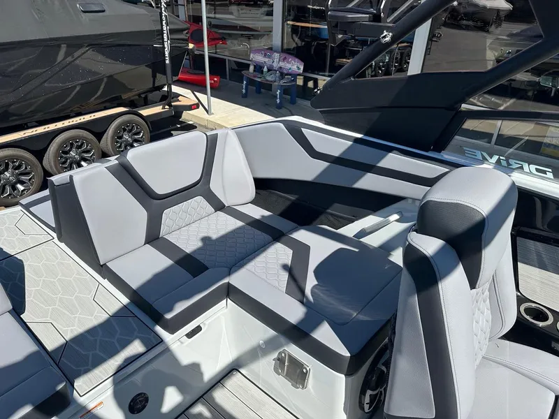 Slide: The Image of 2024 Yamaha 222XD jet boat interior with sleek gray seating and modern design. - 20