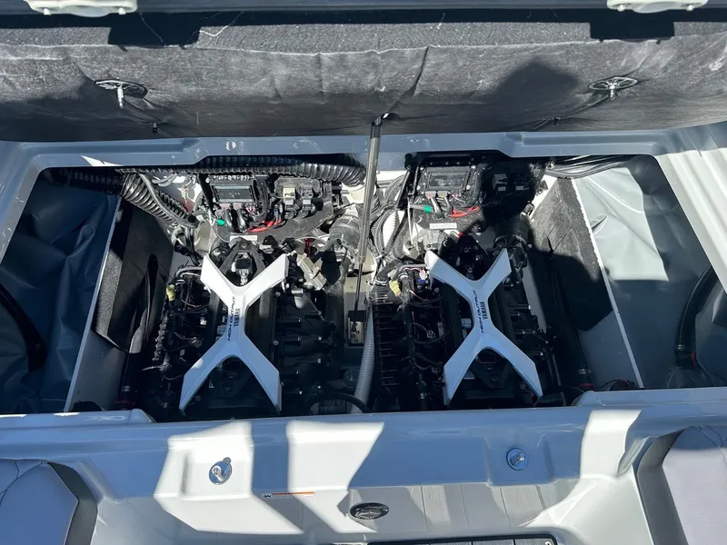Slide: The Image of 2024 Yamaha 222XD jet boat engine compartment with dual engines visible. - 21