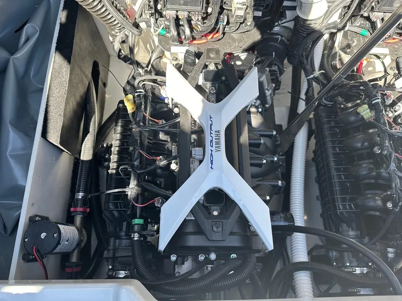 Slide: The Image of 2024 Yamaha 222XD jet boat engine, showcasing high output components and intricate wiring. - 23