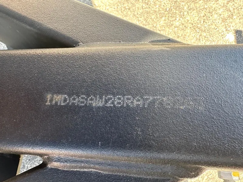 Slide: The Image of Close-up of a 2024 Yamaha 222XD jet boat's hull identification number. - 24