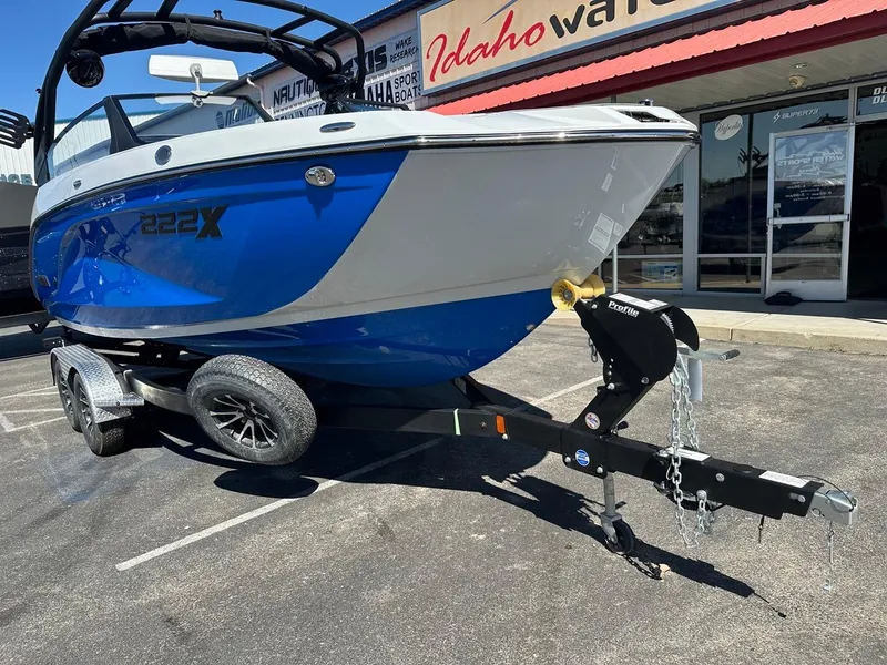 Slide: The Image of 2024 Yamaha 222XD jet boat on trailer, displayed outside dealership. - 3