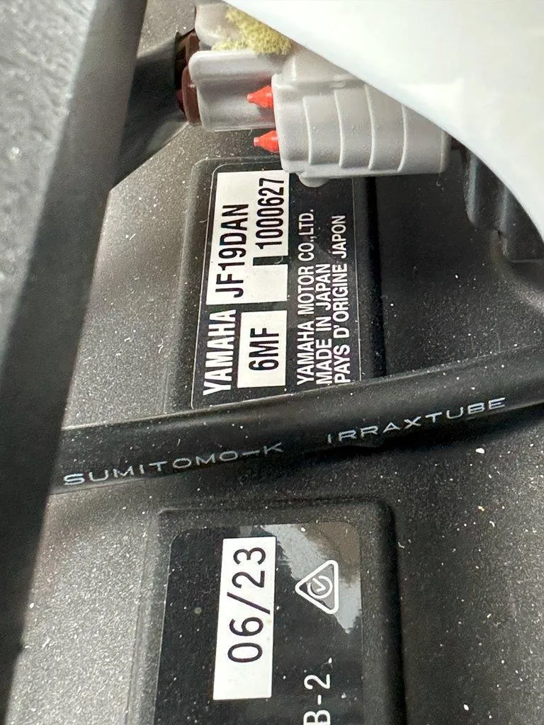 Slide: The Image of Close-up of Yamaha 222XD 2024 engine label with manufacturing details. - 28