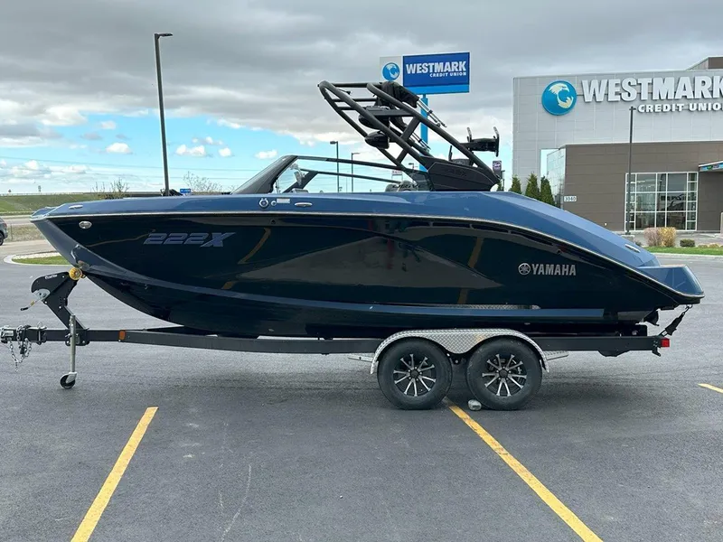 Slide: The Image of 2024 Yamaha 222XD jet boat on trailer, parked near Westmark Credit Union. - 6