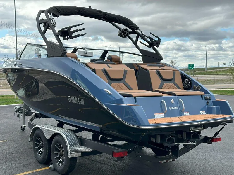Slide: The Image of 2024 Yamaha 222XD jet boat on trailer, featuring sleek design and modern amenities. - 7