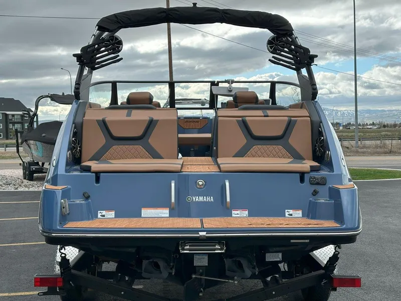 Slide: The Image of 2024 Yamaha 222XD jet boat rear view with stylish seating and modern design. - 8