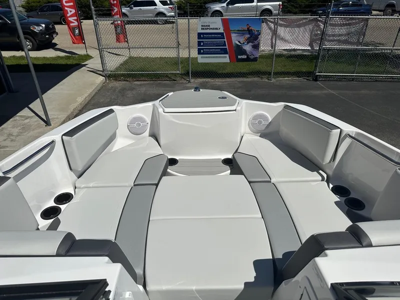 Slide: The Image of 2024 Yamaha AR220 jet boat interior with spacious seating and cup holders. - 14
