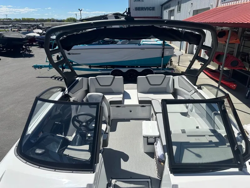 Slide: The Image of 2024 Yamaha AR220 jet boat interior with sleek seating and modern design. - 16