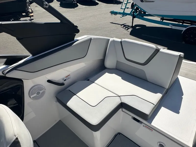 Slide: The Image of 2024 Yamaha AR220 jet boat interior seating with modern design and speaker system. - 18