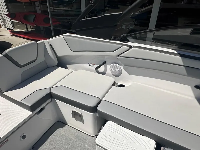 Slide: The Image of 2024 Yamaha AR220 jet boat interior with gray seating and storage compartments. - 19