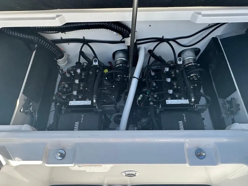 Slide: The Image of 2024 Yamaha AR220 jet boat engine compartment, showcasing dual engines and components. - 20