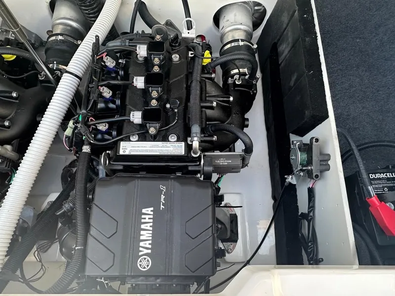 Slide: The Image of 2024 Yamaha AR220 engine compartment showcasing TR-1 engine components and wiring. - 21