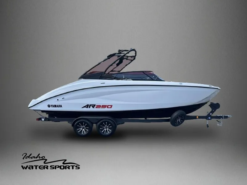 Slide: The Image of 2024 Yamaha AR250 jet boat on trailer, displayed by Idaho Water Sports. - 1