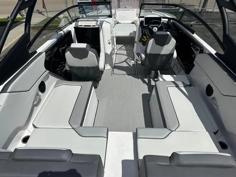 Slide: The Image of 2024 Yamaha AR250 jet boat interior with modern seating and sleek design. - 10