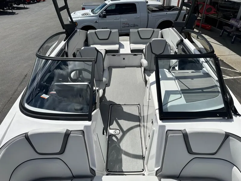 Slide: The Image of 2024 Yamaha AR250 jet boat interior with sleek seating and modern design. - 18