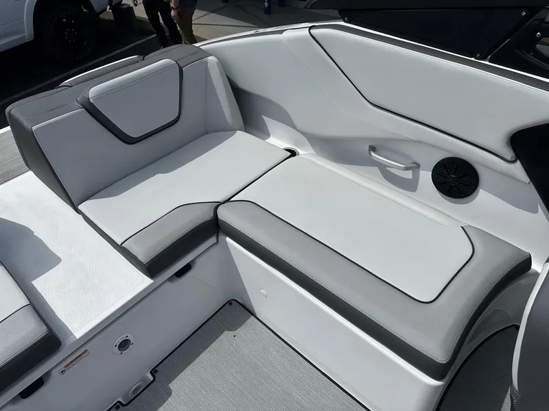 Slide: The Image of 2024 Yamaha AR250 boat interior seating with gray and white upholstery. - 21