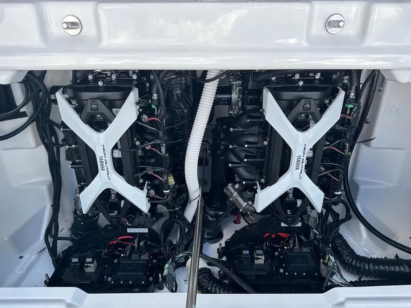 Slide: The Image of 2024 Yamaha AR250 jet boat engine compartment, showcasing dual engines and wiring. - 22