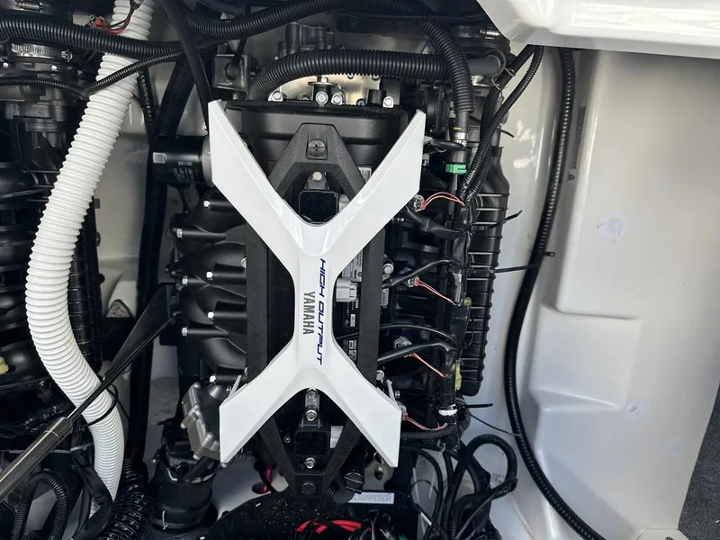 Slide: The Image of 2024 Yamaha AR250 jet boat engine compartment, showcasing high output motor components. - 24