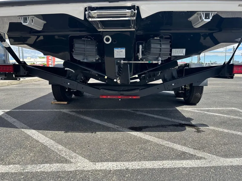 Slide: The Image of 2024 Yamaha AR250 jet boat on trailer, rear view in parking lot. - 25