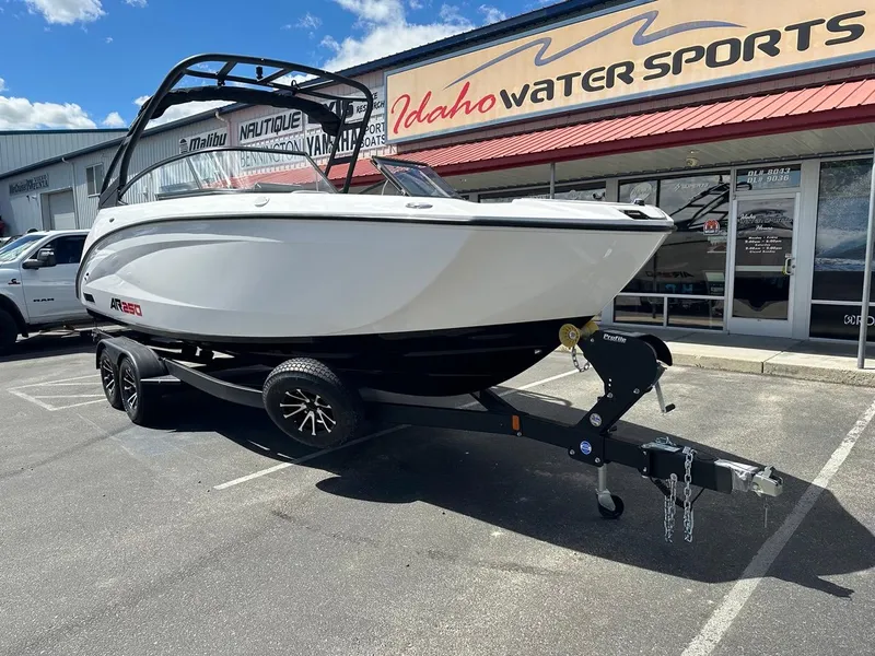 Slide: The Image of 2024 Yamaha AR250 jet boat on trailer at Idaho Water Sports dealership. - 3