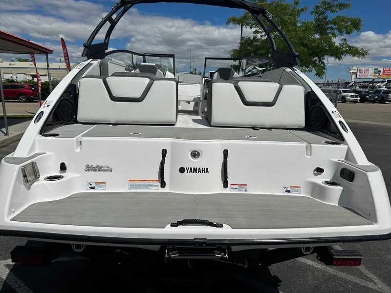 Slide: The Image of 2024 Yamaha AR250 jet boat rear view, showcasing seating and swim platform. - 9