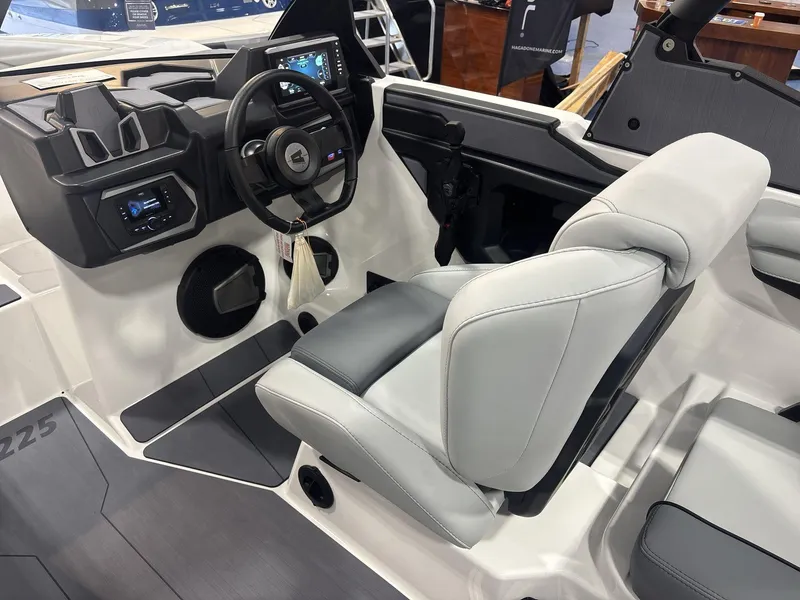 Slide: The Image of 2025 Axis A225 boat interior with modern dashboard and comfortable seating. - 10