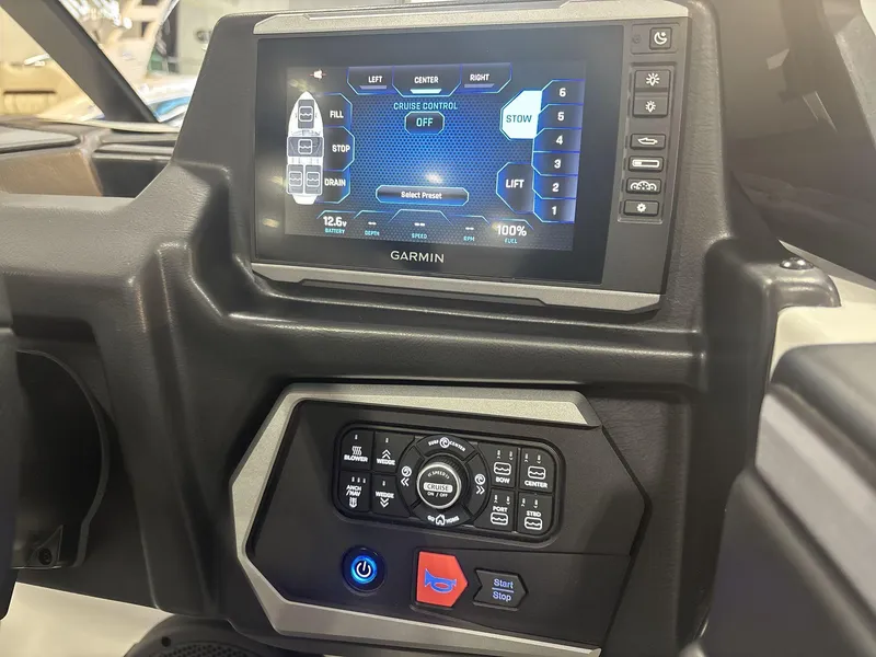 Slide: The Image of Garmin control panel in 2025 Axis A225 boat dashboard, featuring cruise control and system settings. - 12