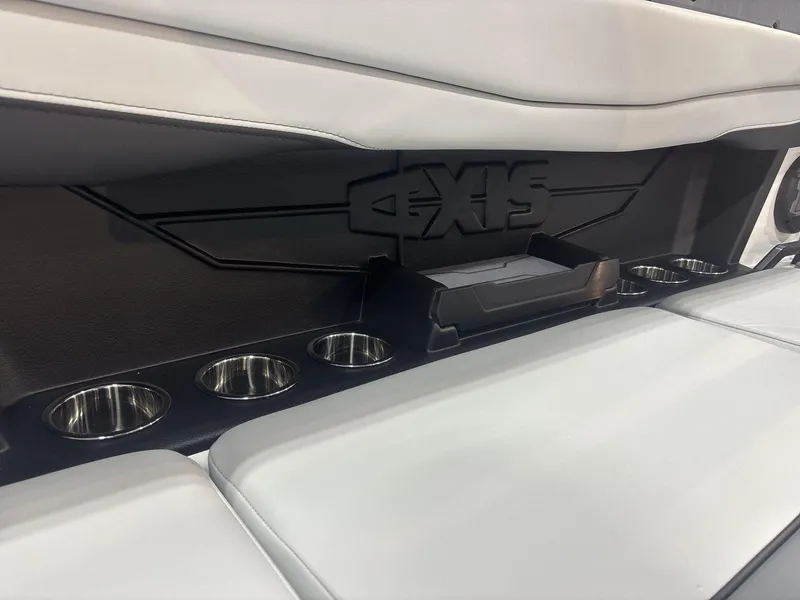 Slide: The Image of 2025 Axis A225 boat interior with cup holders and sleek seating design. - 14