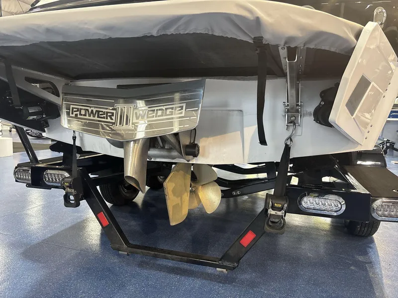 Slide: The Image of Rear view of 2025 Axis A225 boat with Power Wedge III and propeller. - 5