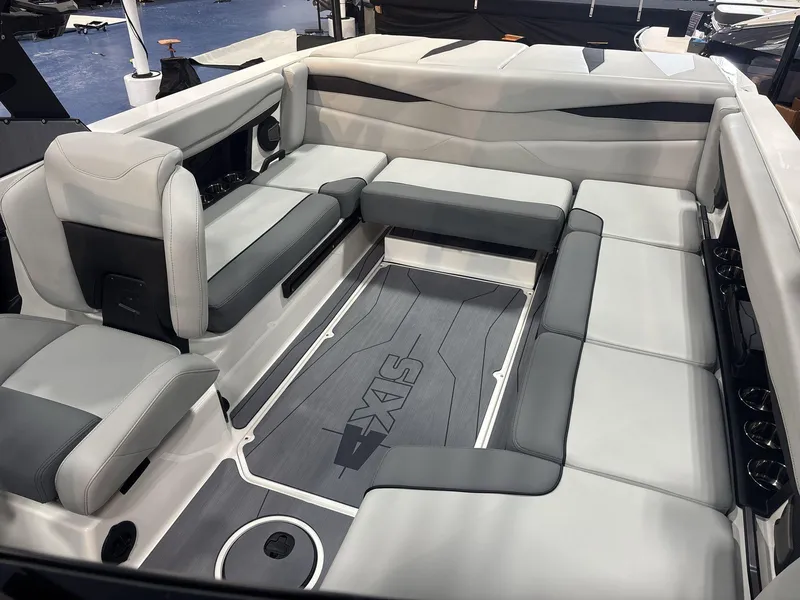Slide: The Image of 2025 Axis A225 boat interior with gray and white seating arrangement. - 8