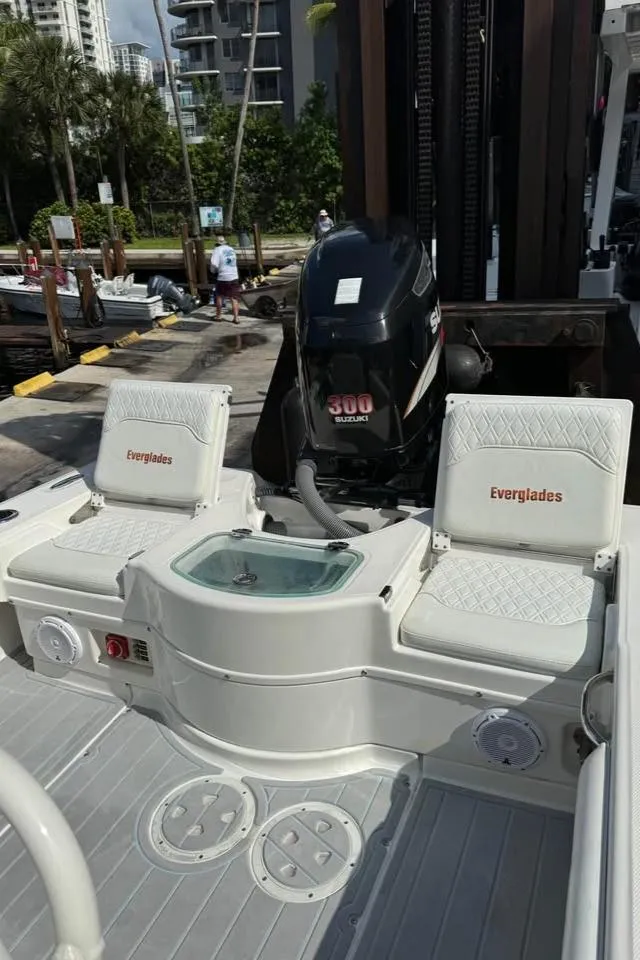 Slide: The Image of 2008 Everglades 243 CC boat with dual seats and powerful outboard motor. - 5