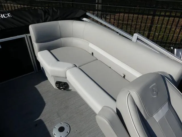 Slide: The Image of 2025 Godfrey Pontoons Xperience 2286 SBX interior with gray seating and speaker. - 12