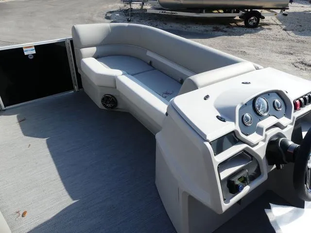 Slide: The Image of 2025 Godfrey Pontoons Xperience 2286 SBX interior with seating and control panel. - 13